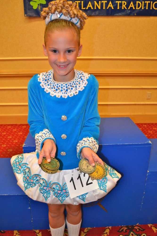 Addie as a young Irish dancer with her medals