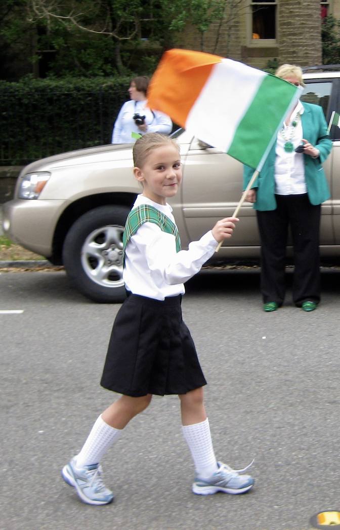Young Addie in a St. Patrick's Day parade with an Irish flag