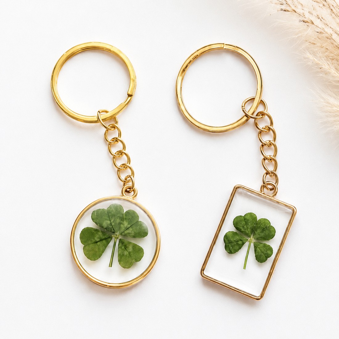 Gold-framed clover keychains — rectangle and circle